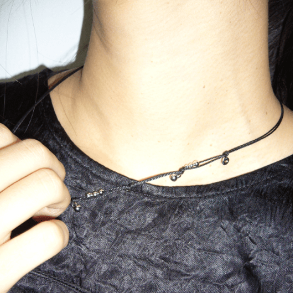 knotted charm necklace