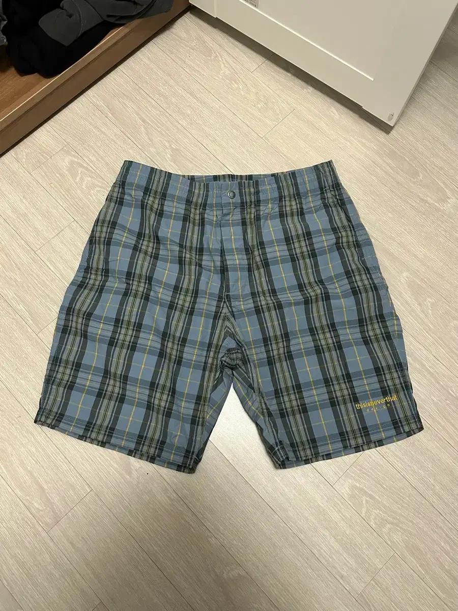 디스이즈네버댓 체크쇼츠 L