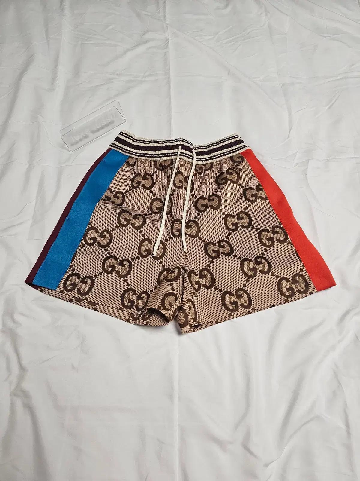 구찌 점보 GG 테이프 트림 슈프림 쇼츠 695745