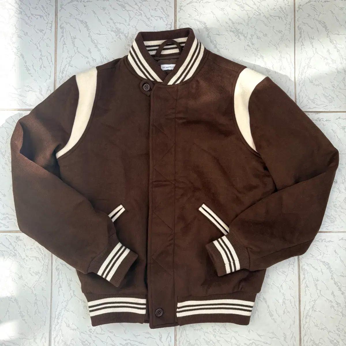 POP TRADING COMPANY RAIN DRUM VARSITY