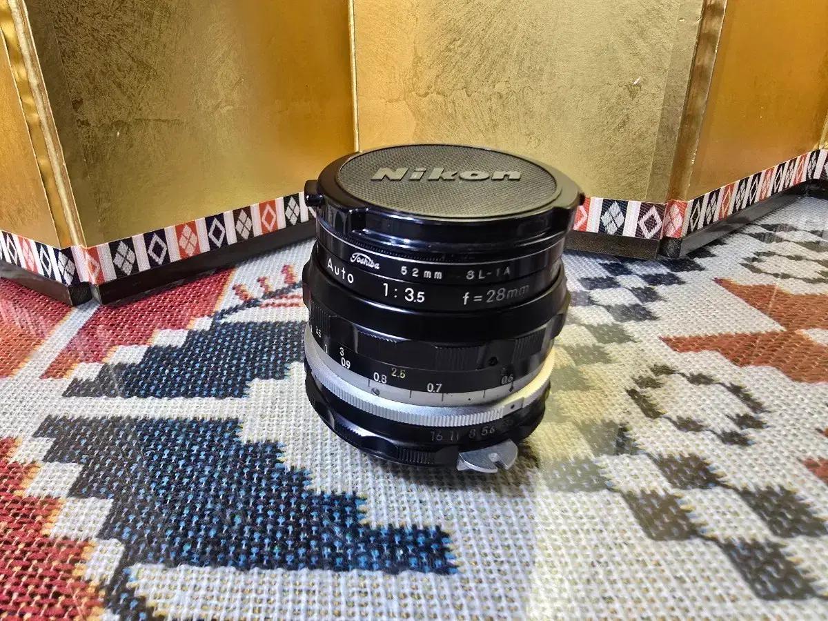 니콘 NIKKOR-H 1:3.5 f=28mm 렌즈