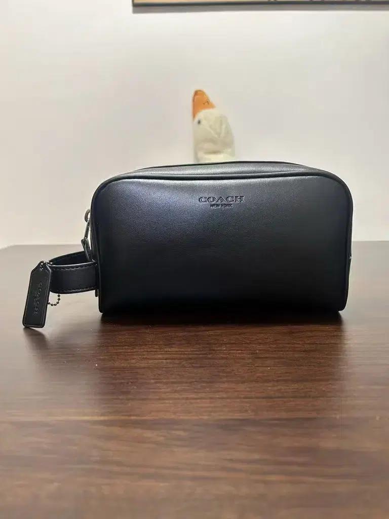 코치 시그니처 올드 플라워 트럼펫 여행 용품 가방